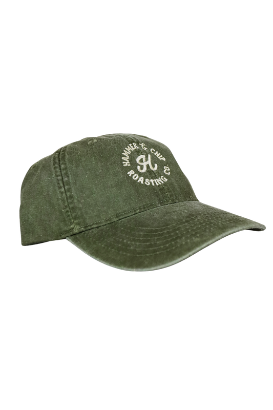 Green cap with white logo on a white background