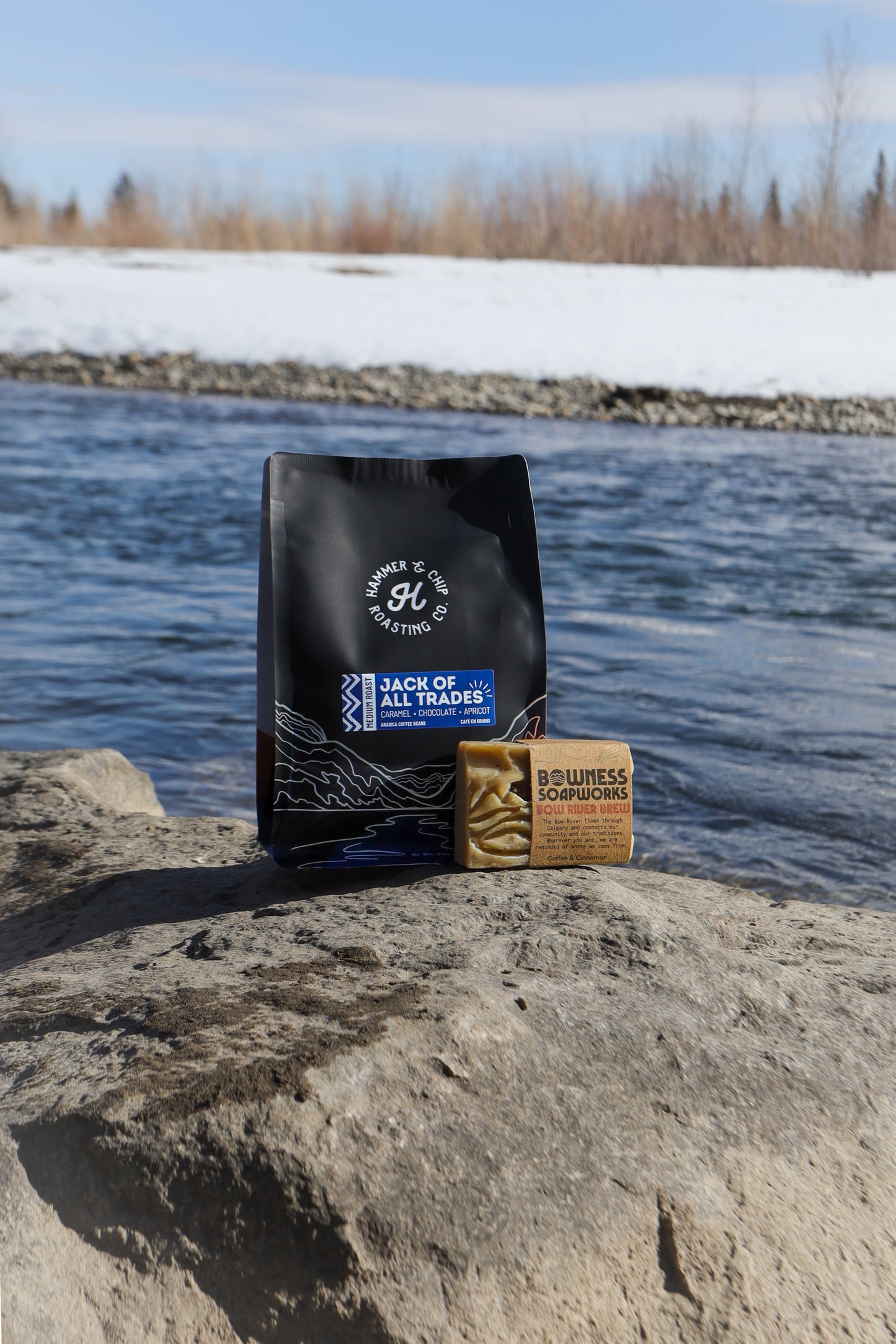 A bag of coffee besides a bar of soap.